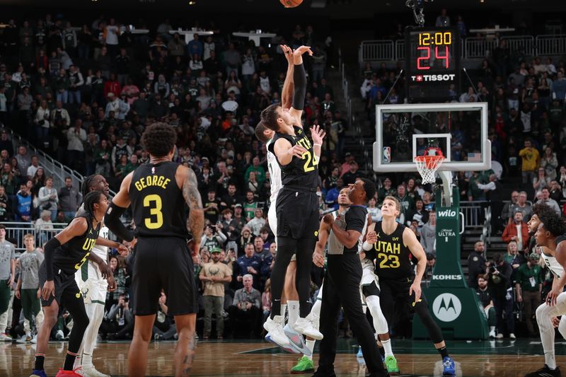 MILWAUKEE, WI - NOVEMBER 7: Walker Kessler #24 of the Utah Jazz takes tip off during the game against the Milwaukee Bucks on November 7, 2024 at Fiserv Forum Center in Milwaukee, Wisconsin. NOTE TO USER: User expressly acknowledges and agrees that, by downloading and or using this Photograph, user is consenting to the terms and conditions of the Getty Images License Agreement. Mandatory Copyright Notice: Copyright 2024 NBAE (Photo by Gary Dineen/NBAE via Getty Images).