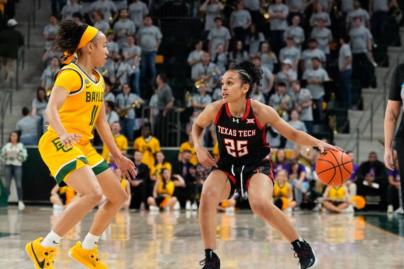 Feb 18, 2024; Waco, Texas, USA; Texas Tech Red Raiders guard Ashley Chevalier (25) controls the ball against Baylor Lady Bears guard Jada Walker (11) during the first half at Paul and Alejandra Foster Pavilion. Mandatory Credit: Chris Jones-USA TODAY Sports

