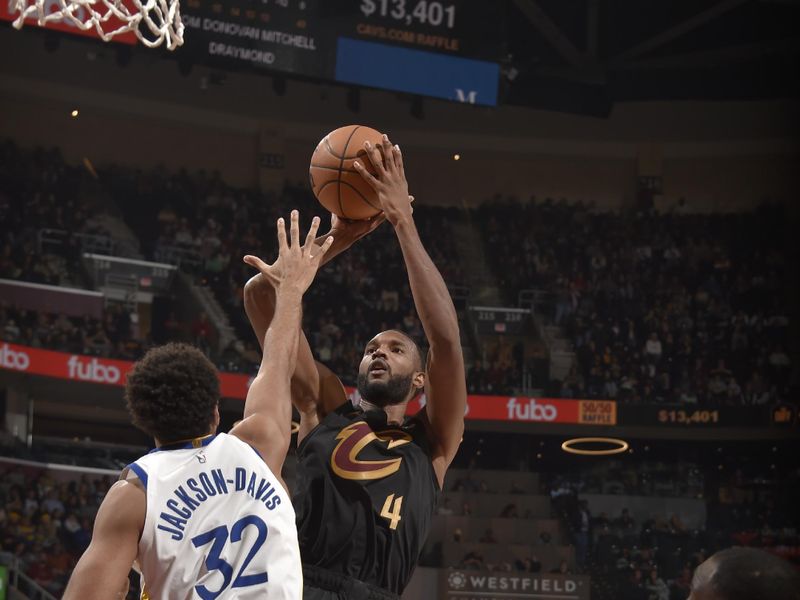 CLEVELAND, OH - NOVEMBER 8: Evan Mobley #4 of the Cleveland Cavaliers shoots the ball during the game against the Golden State Warriors during a regular season game on November 8, 2024 at Rocket Mortgage FieldHouse in Cleveland, Ohio. NOTE TO USER: User expressly acknowledges and agrees that, by downloading and/or using this Photograph, user is consenting to the terms and conditions of the Getty Images License Agreement. Mandatory Copyright Notice: Copyright 2024 NBAE (Photo by David Liam Kyle/NBAE via Getty Images)