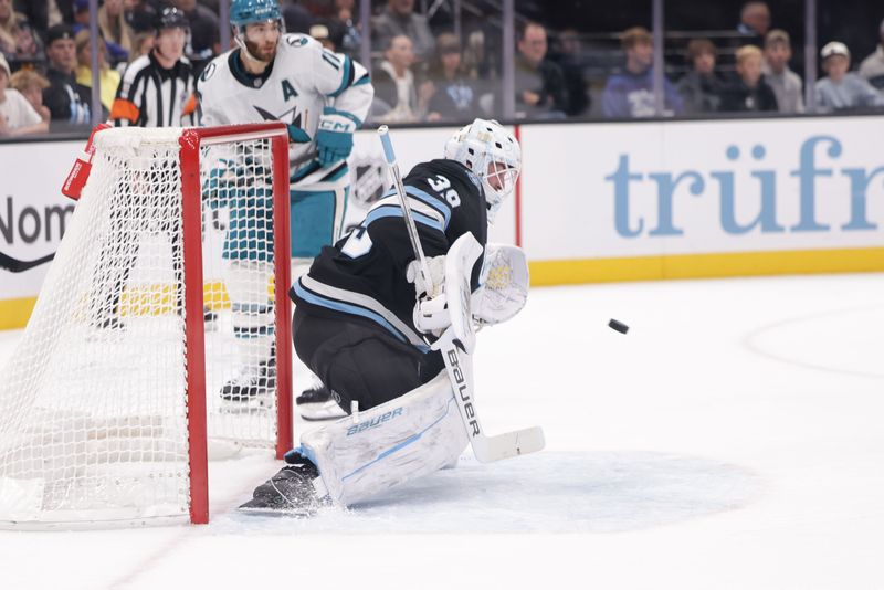 Oct 28, 2024; Salt Lake City, Utah, USA;  Utah Hockey Club goaltender Connor Ingram (39) catches the puck during the first period against the San Jose Sharks at Delta Center. Mandatory Credit: Chris Nicoll-Imagn Images