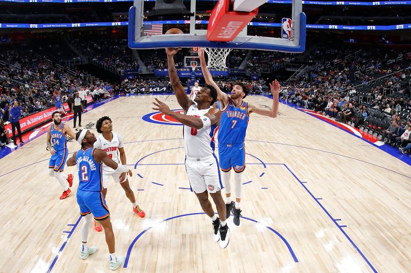 DETROIT, MI - JANUARY 28: Jalen Duren #0 of the Detroit Pistons drives to the basket during the game against the Oklahoma City Thunder on January 28, 2024 at Little Caesars Arena in Detroit, Michigan. NOTE TO USER: User expressly acknowledges and agrees that, by downloading and/or using this photograph, User is consenting to the terms and conditions of the Getty Images License Agreement. Mandatory Copyright Notice: Copyright 2024 NBAE (Photo by Brian Sevald/NBAE via Getty Images)