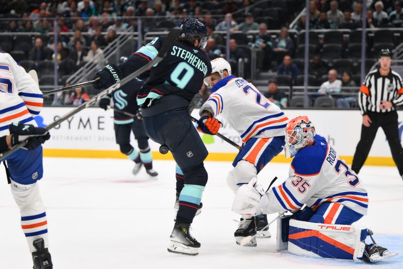 Oct 2, 2024; Seattle, Washington, USA; Seattle Kraken center Chandler Stephenson (9) blocks a goal shot against the Edmonton Oilers during the first period at Climate Pledge Arena. Mandatory Credit: Steven Bisig-Imagn Images