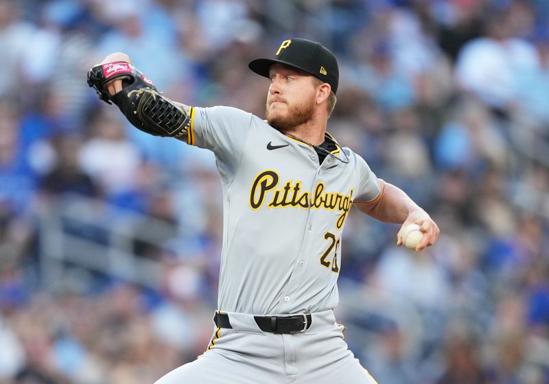 May 31, 2024; Toronto, Ontario, CAN; Pittsburgh Pirates starting pitcher Bailey Falter (26) throws a pitch against the Toronto Blue Jays during the first inning at Rogers Centre. Mandatory Credit: Nick Turchiaro-USA TODAY Sports