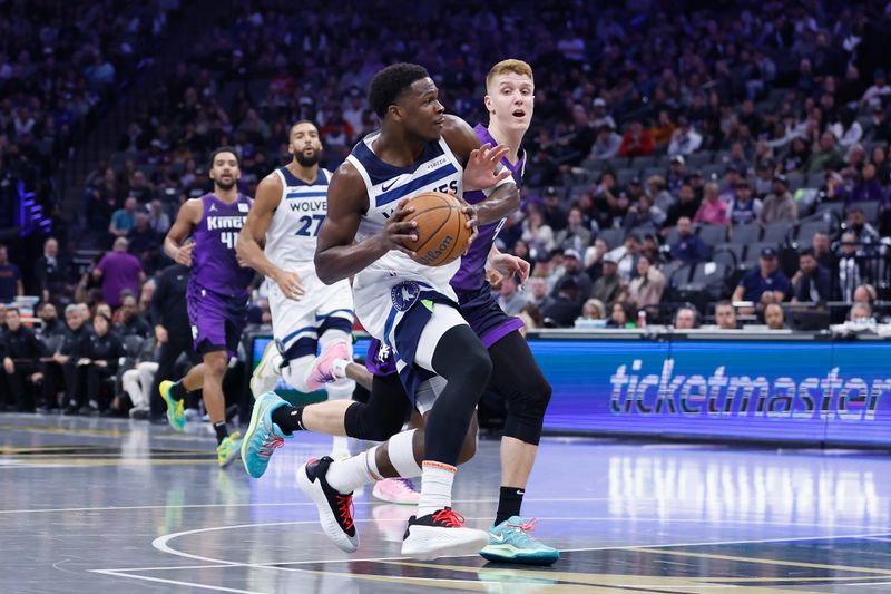 SACRAMENTO, CALIFORNIA - NOVEMBER 15: Anthony Edwards #5 of the Minnesota Timberwolves drives to the basket against Kevin Huerter #9 of the Sacramento Kings during the Emirates NBA Cup game at Golden 1 Center on November 15, 2024 in Sacramento, California. NOTE TO USER: User expressly acknowledges and agrees that, by downloading and or using this photograph, User is consenting to the terms and conditions of the Getty Images License Agreement (Photo by Lachlan Cunningham/Getty Images)