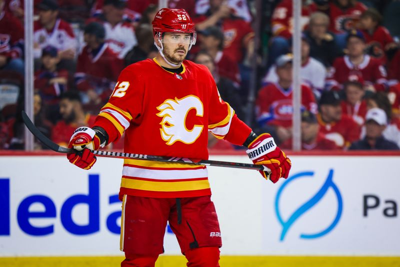 Mar 16, 2024; Calgary, Alberta, CAN; Calgary Flames defenseman MacKenzie Weegar (52) against the Montreal Canadiens during the third period at Scotiabank Saddledome. Mandatory Credit: Sergei Belski-USA TODAY Sports