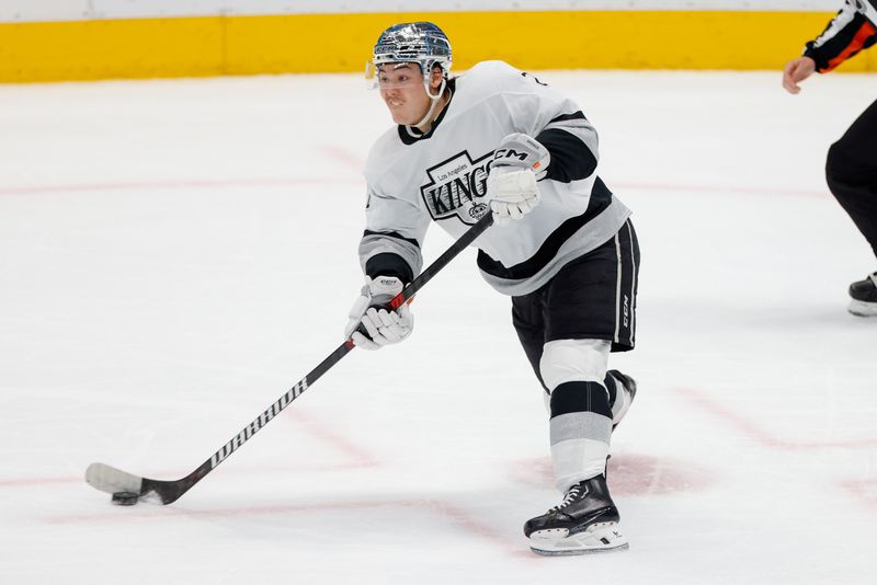 Mar 16, 2024; Dallas, Texas, USA; Los Angeles Kings defenseman Jordan Spence (21) passes the puck during the second period against the Dallas Stars at American Airlines Center. Mandatory Credit: Andrew Dieb-USA TODAY Sports