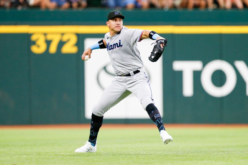 Aug 6, 2023; Arlington, Texas, USA; Miami Marlins right fielder Avisail Garcia (24) fields a ground ball during the third inning against the Texas Rangers at Globe Life Field. Mandatory Credit: Andrew Dieb-USA TODAY Sports