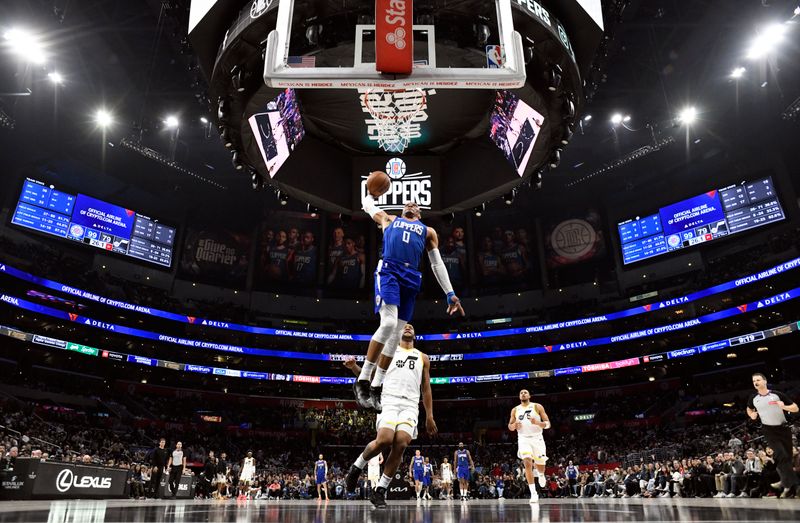 LOS ANGELES, CALIFORNIA - APRIL 5: Russell Westbrook #0 of the Los Angeles Clippers drives to the basket against the Utah Jazz during the second half at Crypto.com Arena on April 5, 2024 in Los Angeles, California. NOTE TO USER: User expressly acknowledges and agrees that, by downloading and or using this photograph, User is consenting to the terms and conditions of the Getty Images License Agreement. (Photo by Kevork Djansezian/Getty Images)