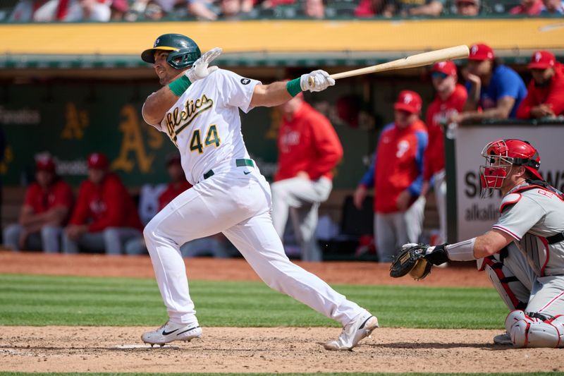 Jun 17, 2023; Oakland, California, USA; Oakland Athletics catcher Carlos Perez (44) hits an RBI single against the Philadelphia Phillies during the eleventh inning at Oakland-Alameda County Coliseum. Mandatory Credit: Robert Edwards-USA TODAY Sports