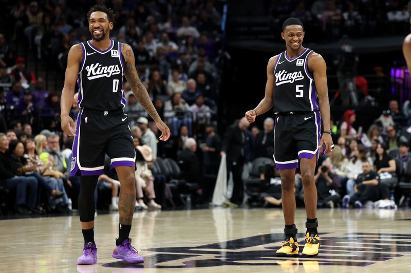 SACRAMENTO, CALIFORNIA - JANUARY 16: Malik Monk #0 and De'Aaron Fox #5 of the Sacramento Kings react after Keegan Murray #13 of the Sacramento Kings made a basket against the Houston Rockets during the second half at Golden 1 Center on January 16, 2025 in Sacramento, California. NOTE TO USER: User expressly acknowledges and agrees that, by downloading and/or using this photograph, user is consenting to the terms and conditions of the Getty Images License Agreement.   (Photo by Ezra Shaw/Getty Images)