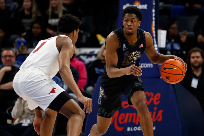 Jan 26, 2023; Memphis, Tennessee, USA; Memphis Tigers guard Elijah McCadden (0) dribbles up the court as Southern Methodist Mustangs guard Zhuric Phelps  (1) defends during the first half at FedExForum. Mandatory Credit: Petre Thomas-USA TODAY Sports