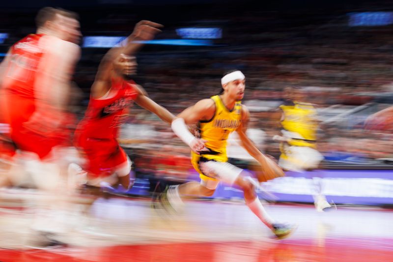 TORONTO, CANADA - FEBRUARY 14: Andrew Nembhard #2 of the Indiana Pacers drives to the net against the Toronto Raptors in the second half of their NBA game at Scotiabank Arena on February 14, 2024 in Toronto, Canada.NOTE TO USER: User expressly acknowledges and agrees that, by downloading and or using this photograph, User is consenting to the terms and conditions of the Getty Images License Agreement. (Photo by Cole Burston/Getty Images)