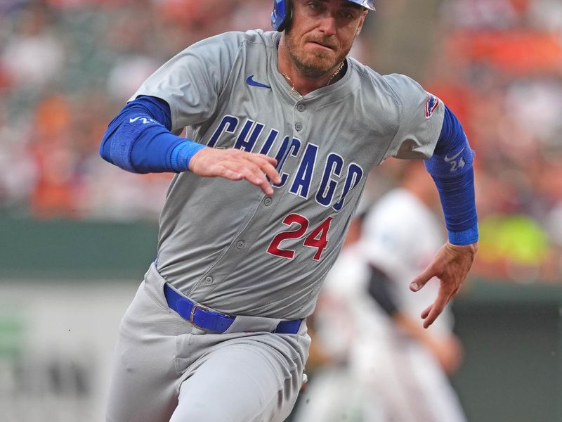 Jul 9, 2024; Baltimore, Maryland, USA; Chicago Cubs outfielder Cody Bellinger (24) rounds third base to score in the third inning against the Baltimore Orioles at Oriole Park at Camden Yards. Mandatory Credit: Mitch Stringer-USA TODAY Sports