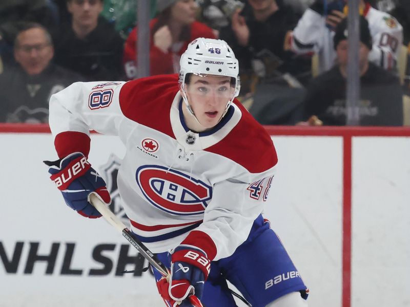 Dec 21, 2025; Pittsburgh, Pennsylvania, USA;  Montréal Canadiens defenseman Lane Hutson (48) skates up ice with the puck against the Pittsburgh Penguins during the second period at PPG Paints Arena. Mandatory Credit: Charles LeClaire-Imagn Images