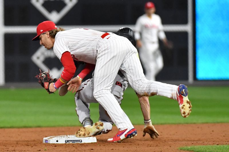 Oct 24, 2023; Philadelphia, Pennsylvania, USA; Arizona Diamondbacks left fielder Corbin Carroll (7) steals second base against Philadelphia Phillies second baseman Bryson Stott (5) in the second inning during game seven of the NLCS for the 2023 MLB playoffs at Citizens Bank Park. Mandatory Credit: Eric Hartline-USA TODAY Sports