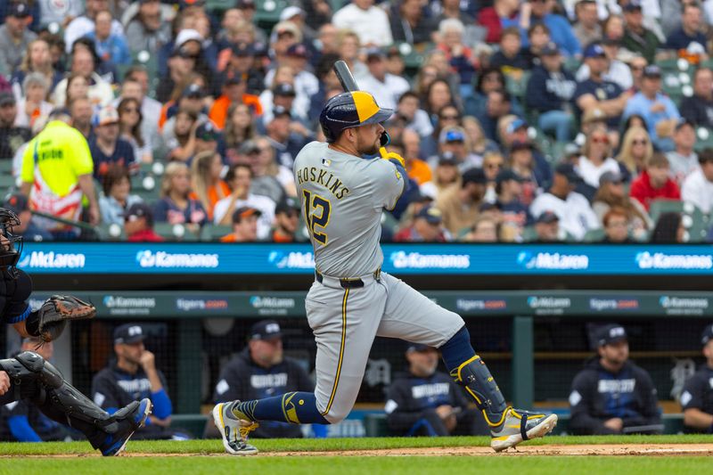 Jun 7, 2024; Detroit, Michigan, USA; Milwaukee Brewers first baseman Rhys Hoskins (12) singles during the second inning of the game against the Detroit Tigers at Comerica Park. Mandatory Credit: Brian Bradshaw Sevald-USA TODAY Sports