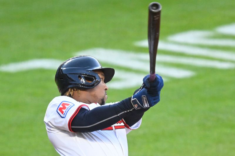 Apr 12, 2025; Cleveland, Ohio, USA; Cleveland Guardians third baseman Jose Ramirez (11) singles in the fourth inning against the Kansas City Royals at Progressive Field. Mandatory Credit: David Richard-Imagn Images