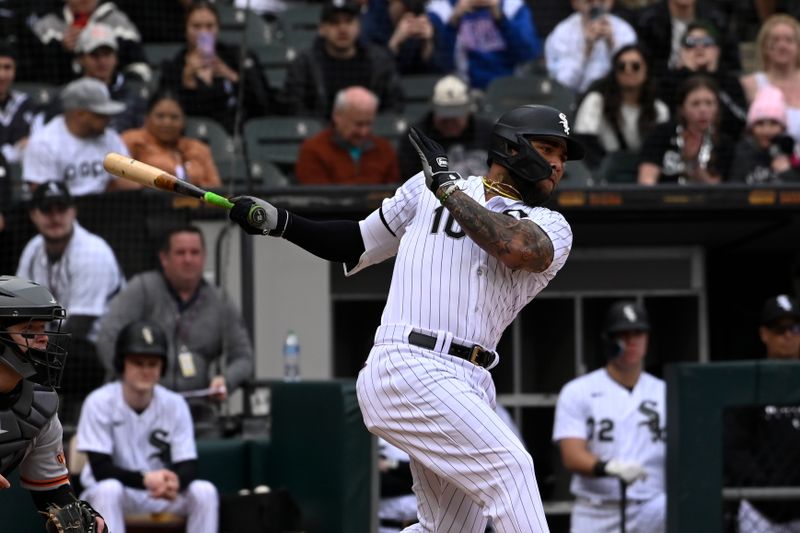 Apr 5, 2023; Chicago, Illinois, USA;  Chicago White Sox third baseman Yoan Moncada (10) hits an RBI single during the seventh  inning against the San Francisco Giants at Guaranteed Rate Field. Mandatory Credit: Matt Marton-USA TODAY Sports