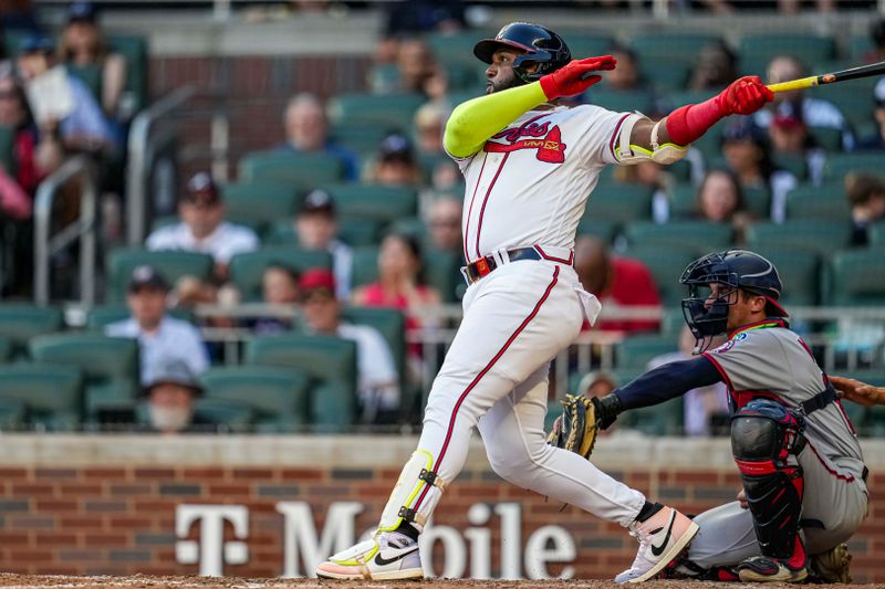 Oct 1, 2023; Cumberland, Georgia, USA; Atlanta Braves designated hitter Marcell Ozuna (20) hits a home run against the Washington Nationals to tie the Major League team record for home runs hit in a season during the ninth inning at Truist Park. Mandatory Credit: Dale Zanine-USA TODAY Sports