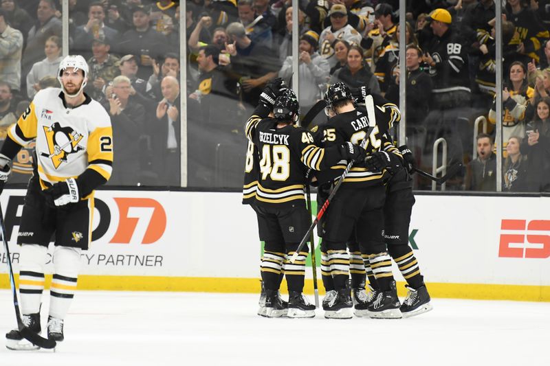 Jan 4, 2024; Boston, Massachusetts, USA; Boston Bruins defenseman Brandon Carlo (25) celebrates his goal with his teammates during the second period against the Pittsburgh Penguins at TD Garden. Mandatory Credit: Bob DeChiara-USA TODAY Sports