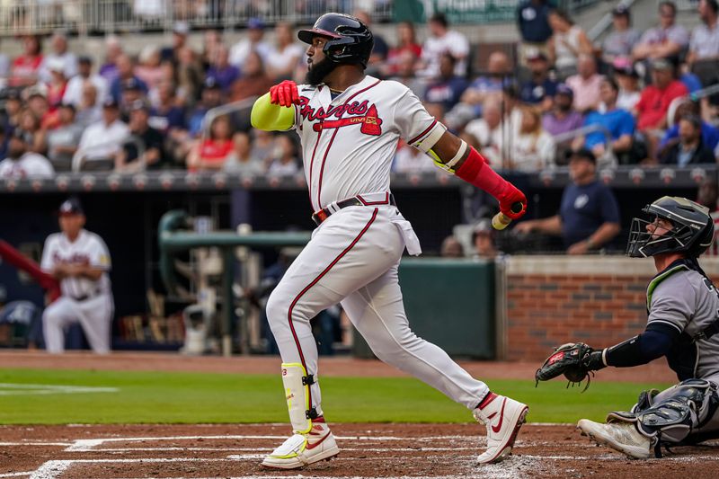 Aug 15, 2023; Cumberland, Georgia, USA; Atlanta Braves designated hitter Marcell Ozuna (20) follows through after hitting a home run against the New York Yankees during the first inning at Truist Park. Mandatory Credit: Dale Zanine-USA TODAY Sports