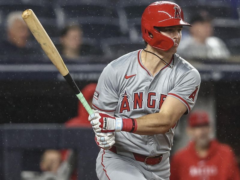 Aug 8, 2024; Bronx, New York, USA;  Los Angeles Angels center fielder Mickey Moniak (16) hits an RBI single in the fifth inning against the New York Yankees at Yankee Stadium. Mandatory Credit: Wendell Cruz-USA TODAY Sports