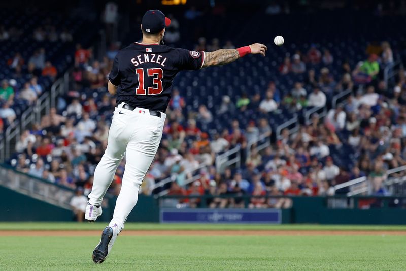 Jun 4, 2024; Washington, District of Columbia, USA; Washington Nationals third base Nick Senzel (13) makes a throw to first base on a ground ball by New York Mets third base Mark Vientos (not pictured) during the eighth inning at Nationals Park. Mandatory Credit: Geoff Burke-USA TODAY Sports