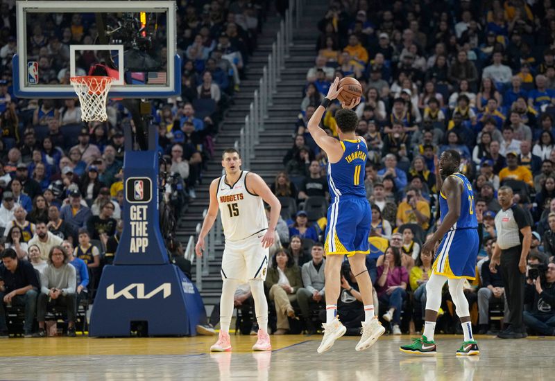 SAN FRANCISCO, CALIFORNIA - FEBRUARY 25: Klay Thompson #11 of the Golden State Warriors shoots a three-point shot over Nikola Jokic #15 of the Denver Nuggets in the first quarter of an NBA basketball game at Chase Center on February 25, 2024 in San Francisco, California. NOTE TO USER: User expressly acknowledges and agrees that, by downloading and or using this photograph, User is consenting to the terms and conditions of the Getty Images License Agreement. (Photo by Thearon W. Henderson/Getty Images)