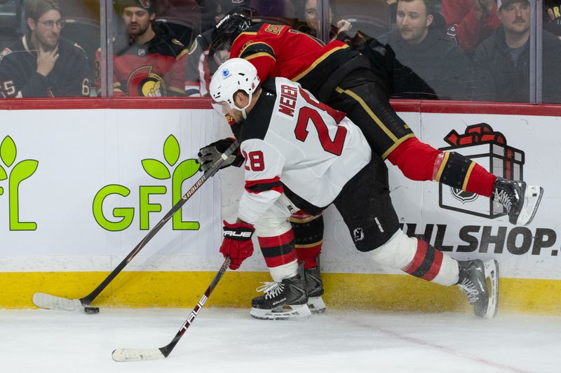 Dec 9, 2025; Ottawa, Ontario, CAN; New Jersey Devils right wing Timo Meier (28) and Ottawa Senators right wing Drake Batherson (19) battle for control of the puck in the third period at the Canadian Tire Centre. Mandatory Credit: Marc DesRosiers-IMAGN Images