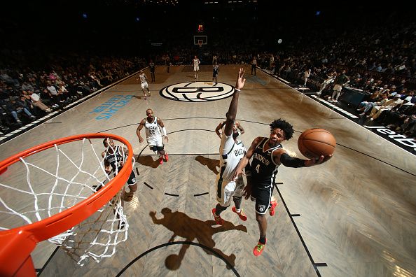 BROOKLYN, NY - DECEMBER 27: Dennis Smith Jr. #4 of the Brooklyn Nets drives to the basket during the game against the Milwaukee Bucks on December 27, 2023 at Barclays Center in Brooklyn, New York. NOTE TO USER: User expressly acknowledges and agrees that, by downloading and or using this Photograph, user is consenting to the terms and conditions of the Getty Images License Agreement. Mandatory Copyright Notice: Copyright 2023 NBAE (Photo by Nathaniel S. Butler/NBAE via Getty Images)