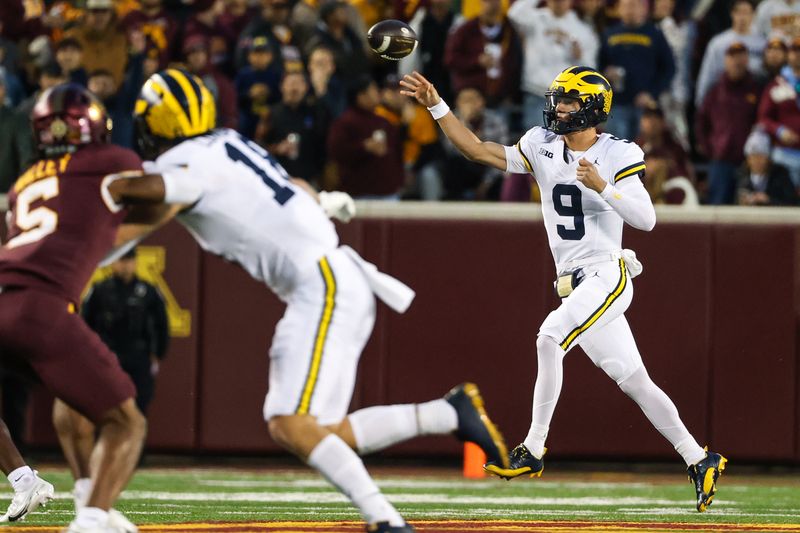 Oct 7, 2023; Minneapolis, Minnesota, USA; Michigan Wolverines quarterback J.J. McCarthy (9) passes against the Minnesota Golden Gophers during the first quarter at Huntington Bank Stadium. Mandatory Credit: Matt Krohn-USA TODAY Sports