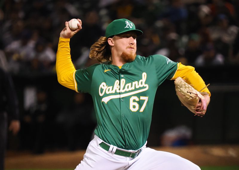 Sep 25, 2024; Oakland, California, USA; Oakland Athletics relief pitcher Grant Homan (67) pitches the ball against the Texas Rangers during the ninth inning at Oakland-Alameda County Coliseum. Mandatory Credit: Kelley L Cox-Imagn Images