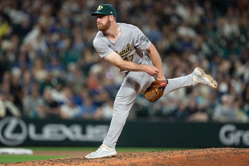 May 10, 2024; Seattle, Washington, USA; Oakland Athletics reliever Michael Kelly (47) delivers a pitch during the seventh inning against the Seattle Mariners at T-Mobile Park. Mandatory Credit: Stephen Brashear-USA TODAY Sports