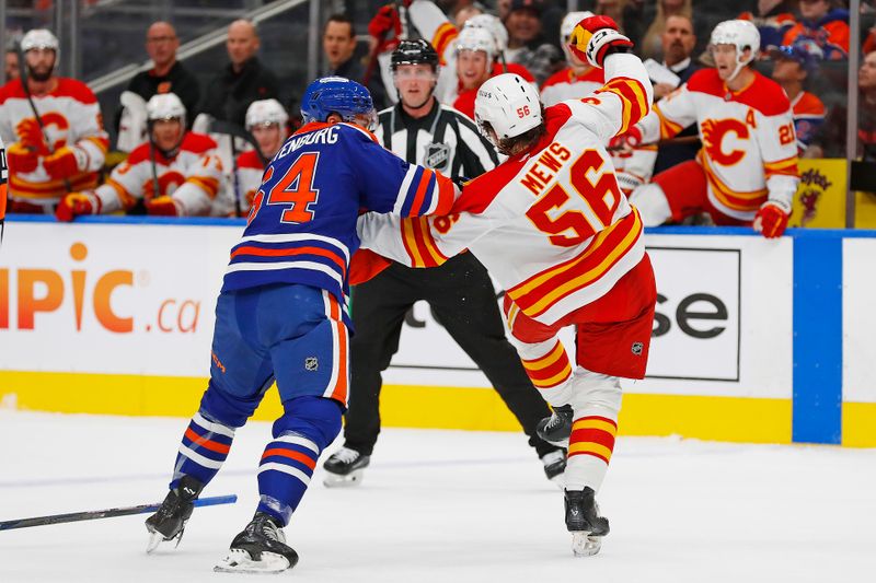 Sep 23, 2024; Edmonton, Alberta, CAN; Edmonton Oilers forward Connor Clattenburg (64) and Calgary Flames defensemen Henry Mews (56) fight during the first period at Rogers Place. Mandatory Credit: Perry Nelson-Imagn Images