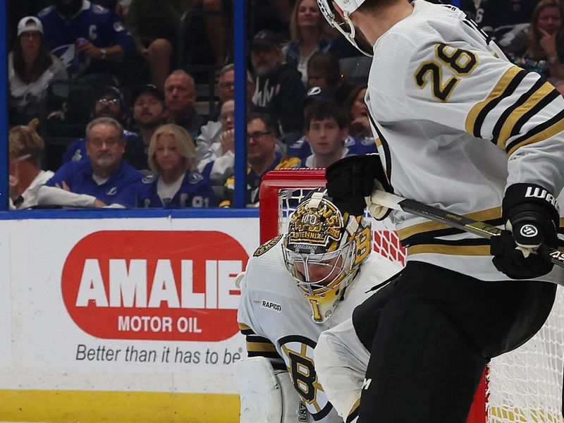 Nov 20, 2023; Tampa, Florida, USA; Boston Bruins goaltender Jeremy Swayman (1) makes a save against the Tampa Bay Lightning during the third period at Amalie Arena. Mandatory Credit: Kim Klement Neitzel-USA TODAY Sports