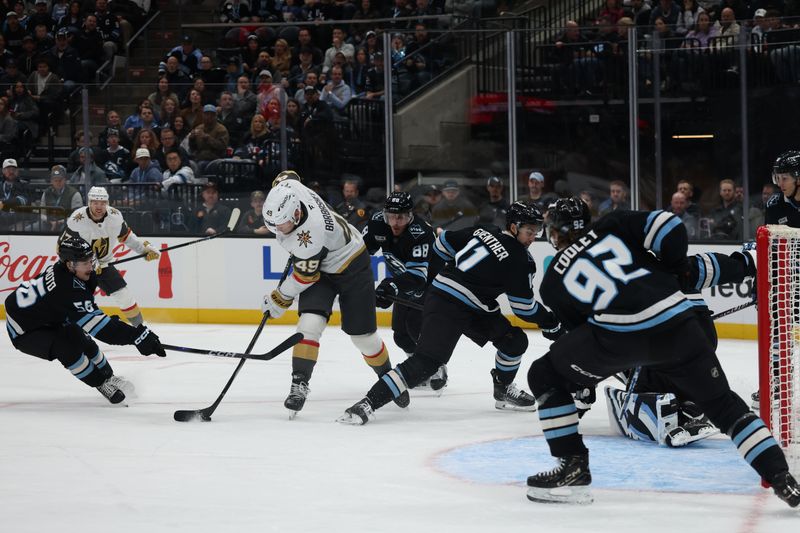 Nov 24, 2025; Salt Lake City, Utah, USA; Vegas Golden Knights left wing Ivan Barbashev (49) looks to shoot against the Utah Mammoth during the second period at Delta Center. Mandatory Credit: Rob Gray-Imagn Images