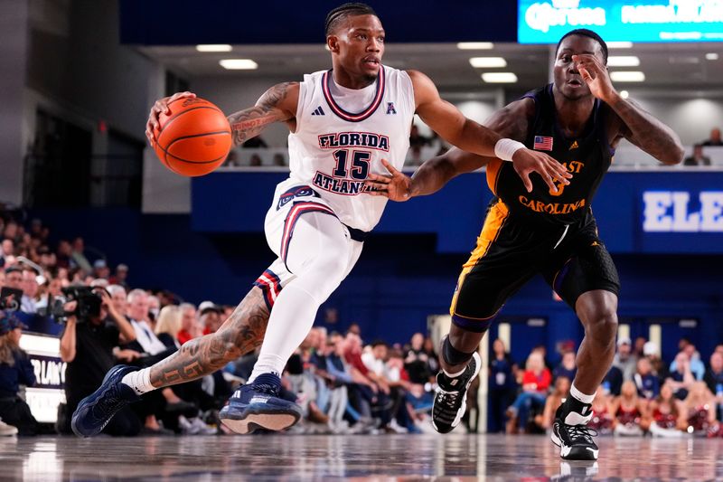 Jan 2, 2024; Boca Raton, Florida, USA; Florida Atlantic Owls guard Alijah Martin (15) dribbles the ball against East Carolina Pirates guard RJ Felton (3) during the second half at Eleanor R. Baldwin Arena. Mandatory Credit: Rich Storry-USA TODAY Sports