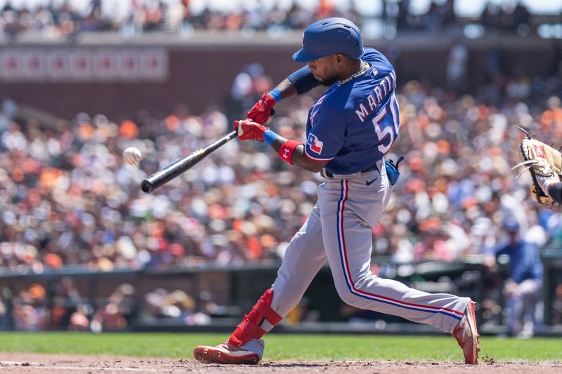 Aug 13, 2023; San Francisco, California, USA; Texas Rangers left fielder Julio Pablo Martinez (50) hits a single during the fourth inning against the San Francisco Giants at Oracle Park. Mandatory Credit: Stan Szeto-USA TODAY Sports