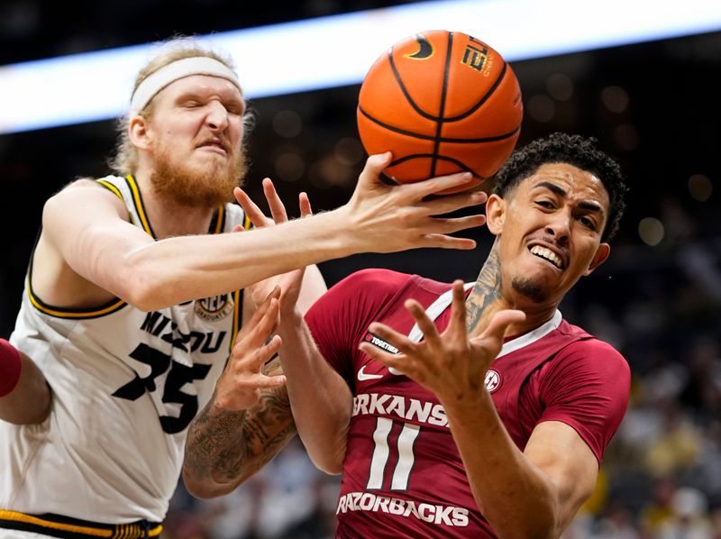 Jan 31, 2024; Columbia, Missouri, USA; Missouri Tigers center Connor Vanover (75) and Arkansas Razorbacks forward Jalen Graham (11) fight for a rebound during the first half at Mizzou Arena. Mandatory Credit: Jay Biggerstaff-USA TODAY Sports