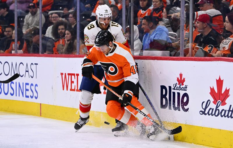 Mar 21, 2023; Philadelphia, Pennsylvania, USA; Philadelphia Flyers defenseman Cam York (45) and Florida Panthers left wing Matthew Tkachuk (19) battle for the puck in the second period at Wells Fargo Center. Mandatory Credit: Kyle Ross-USA TODAY Sports