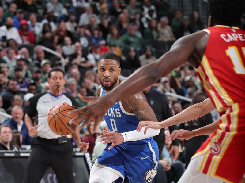 MILWAUKEE, WI - DECEMBER 4: Damian Lillard #0 of the Milwaukee Bucks drives to the basket during the game against the Atlanta Hawks  during a regular season game on December 4, 2024 at Fiserv Forum Center in Milwaukee, Wisconsin. NOTE TO USER: User expressly acknowledges and agrees that, by downloading and or using this Photograph, user is consenting to the terms and conditions of the Getty Images License Agreement. Mandatory Copyright Notice: Copyright 2024 NBAE (Photo by Gary Dineen/NBAE via Getty Images).