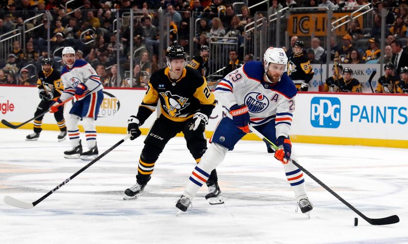 Mar 10, 2024; Pittsburgh, Pennsylvania, USA;  Edmonton Oilers center Leon Draisaitl (29) moves the puck against Pittsburgh Penguins center Lars Eller (20) during the first period at PPG Paints Arena. Mandatory Credit: Charles LeClaire-USA TODAY Sports