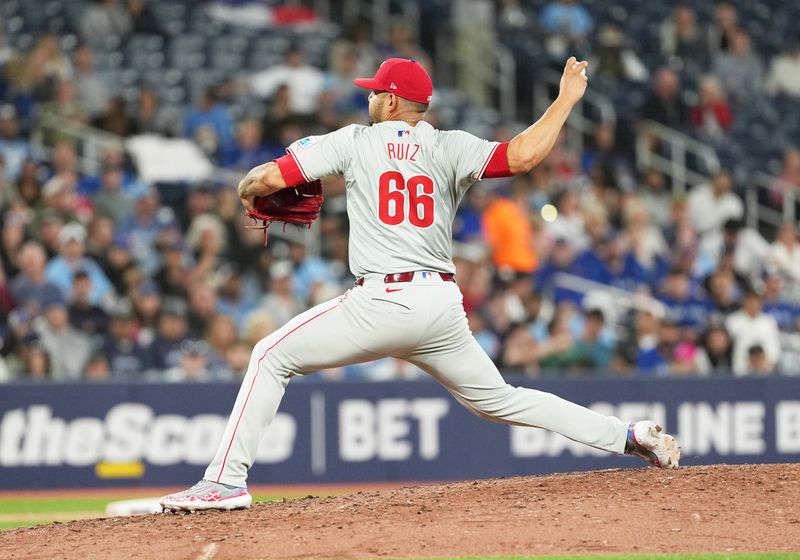 Sep 3, 2024; Toronto, Ontario, CAN; Philadelphia Phillies relief pitcher Jose Ruiz (66) throws a pitch against the Toronto Blue Jays during the seventh inning at Rogers Centre. Mandatory Credit: Nick Turchiaro-Imagn Images