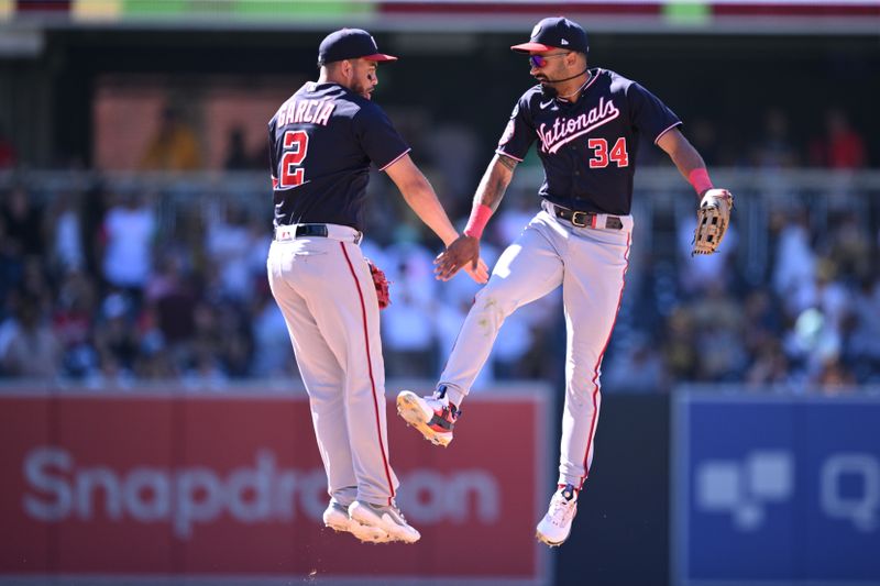 Jun 25, 2023; San Diego, California, USA; Washington Nationals second baseman Luis Garcia (2) and center fielder Derek Hill (34) celebrate on the field after defeating the San Diego Padres at Petco Park. Mandatory Credit: Orlando Ramirez-USA TODAY Sports