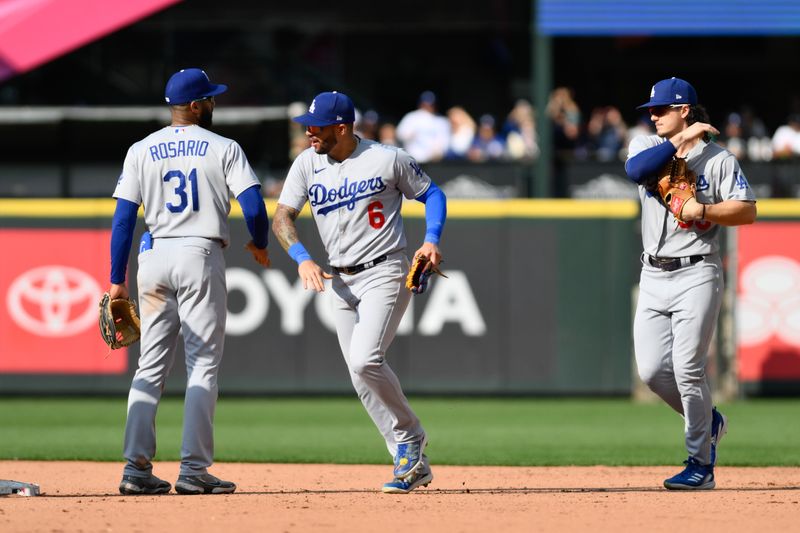 Sep 17, 2023; Seattle, Washington, USA; Los Angeles Dodgers shortstop Amed Rosario (31) and left fielder David Peralta (6) celebrate defeating the Seattle Mariners at T-Mobile Park. Mandatory Credit: Steven Bisig-USA TODAY Sports