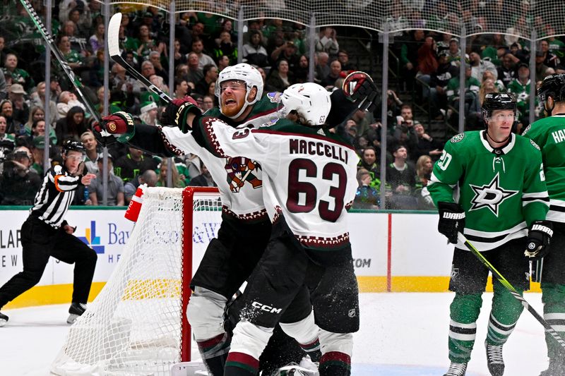 Nov 14, 2023; Dallas, Texas, USA; Arizona Coyotes left wing Lawson Crouse (67) and left wing Matias Maccelli (63) celebrates after Crouse scores a goal against Dallas Stars goaltender Jake Oettinger (29) during the third period at the American Airlines Center. Mandatory Credit: Jerome Miron-USA TODAY Sports