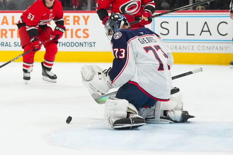 Dec 9, 2025; Raleigh, North Carolina, USA;  Columbus Blue Jackets goaltender Jet Greaves (73) makes a save against the Carolina Hurricanes during the first period at Lenovo Center. Mandatory Credit: James Guillory-Imagn Images