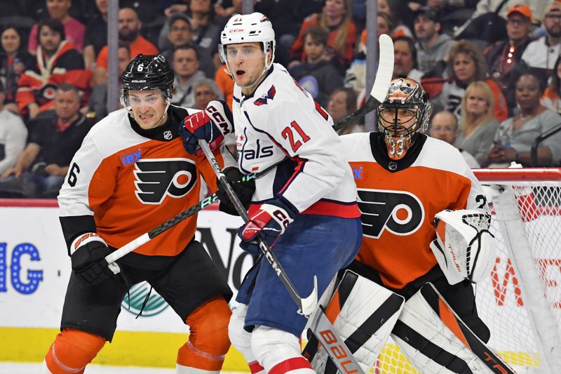 Apr 16, 2024; Philadelphia, Pennsylvania, USA; Philadelphia Flyers defenseman Travis Sanheim (6) and Washington Capitals center Aliaksei Protas (21) battle for position in front of goaltender Samuel Ersson (33) during the first period at Wells Fargo Center. Mandatory Credit: Eric Hartline-USA TODAY Sports