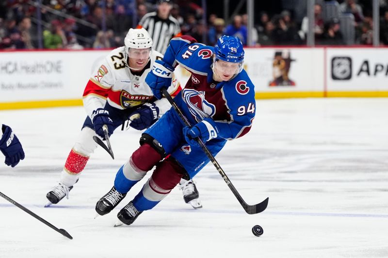 Jan 6, 2025; Denver, Colorado, USA; Colorado Avalanche left wing Joel Kiviranta (94) controls the puck in the second period against the Florida Panthers at Ball Arena. Mandatory Credit: Ron Chenoy-Imagn Images