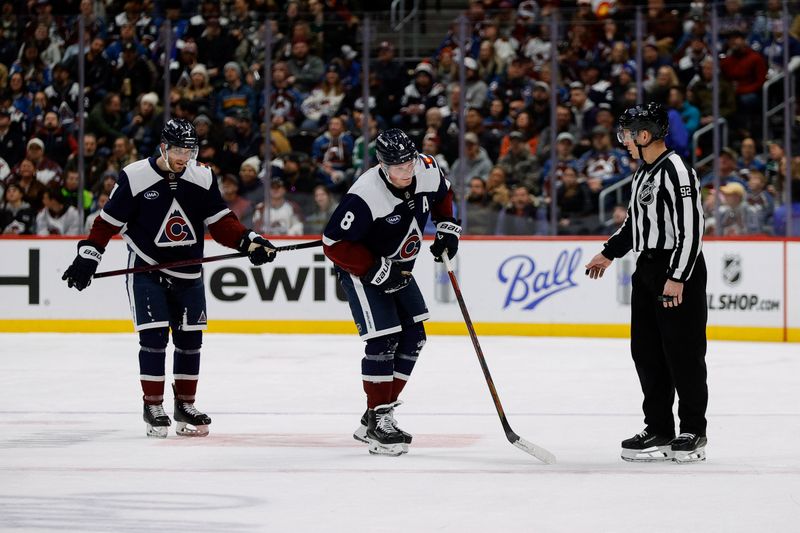 Jan 18, 2025; Denver, Colorado, USA; Colorado Avalanche defenseman Cale Makar (8) hobbles to the bench ahead of defenseman Devon Toews (7) and linesman Mark Shewchyk (92) in the second period against the Dallas Stars at Ball Arena. Mandatory Credit: Isaiah J. Downing-Imagn Images